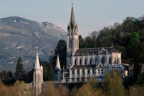 The magnificent Upper Basilica of Our Lady of Rosary in Lourdes - Credit: Getty