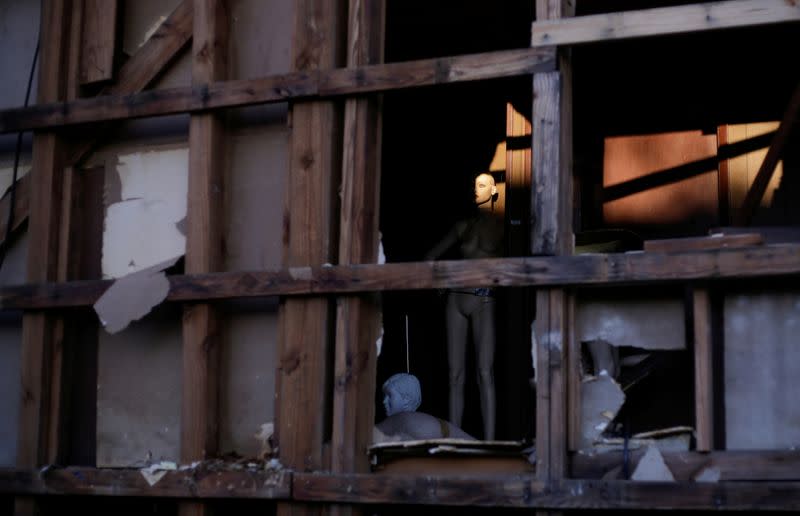 A mannequin is seen inside a building damaged by Hurricane Laura the day after Hurricane Delta swept through Lake Charles