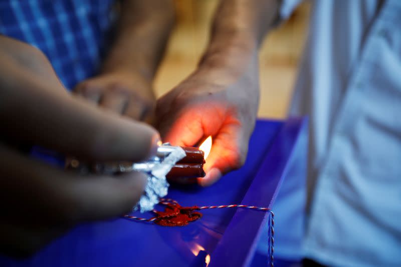 Election officials seal a ballot box during the test and opening of a voting station ahead of the general election in Podgorica, Montenegro