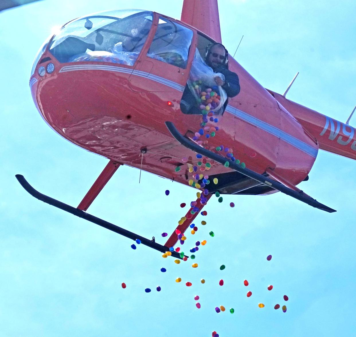 A helicopter drops 75,000 Easter eggs filled with goodies for kids at The Liquid Church following Easter services.