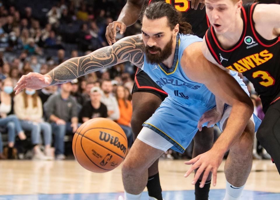 Memphis Grizzlies center Steven Adams (4) reaches for a loose ball lays during their game at FedExForum on Friday, Nov. 26, 2021.