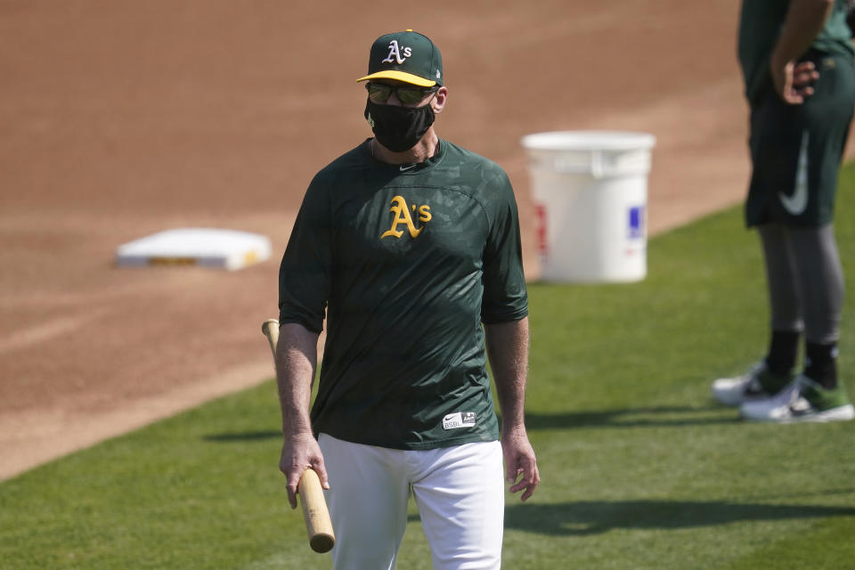 Oakland Athletics manager Bob Melvin watches players practice during a baseball workout in Oakland, Calif., Monday, Sept. 28, 2020. The Athletics are scheduled to play the Chicago White Sox in an American League wild-card playoff series starting Tuesday. (AP Photo/Jeff Chiu)