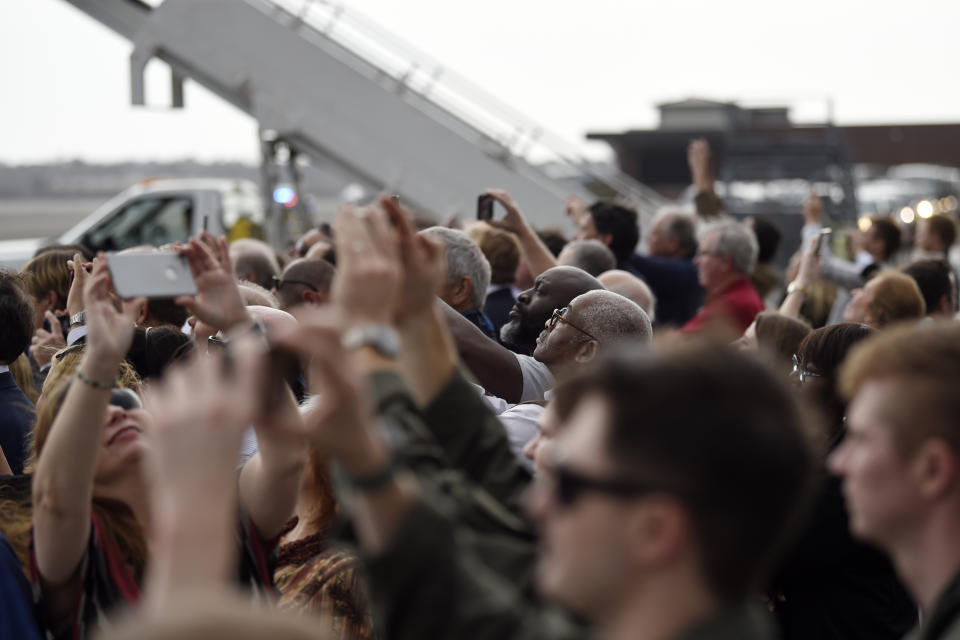 Supporters film the arrival of Vice President Mike Pence at Joint Base Charleston in North Charleston, S.C.m Thursday, Feb. 13, 2020. (AP Photo/Meg Kinnard