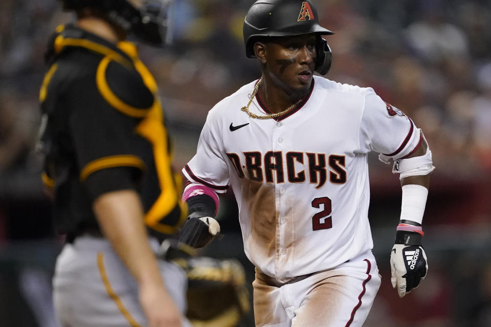 Arizona Diamondbacks' Geraldo Perdomo scores on a ground ball double play hit by Alek Thomas during the sixth inning of a baseball game against the Pittsburgh Pirates, Monday, Aug. 8, 2022, in Phoenix. (AP Photo/Matt York)