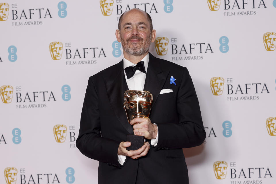 Edward Berger poses for photographers with the Director Award for the film 'All Quiet on the Western Front' at the 76th British Academy Film Awards, BAFTA's, in London, Sunday, Feb. 19, 2023 (Photo by Vianney Le Caer/Invision/AP)