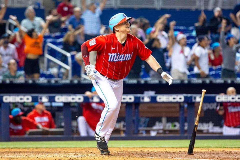 Miami Marlins batter Garrett Cooper (26) reacts to his hit before flying out during the ninth inning of an MLB game against the Atlanta Braves at loanDepot park in the Little Havana neighborhood of Miami, Florida, on Saturday, July 10, 2021. Atlanta defeated Miami 5-4.