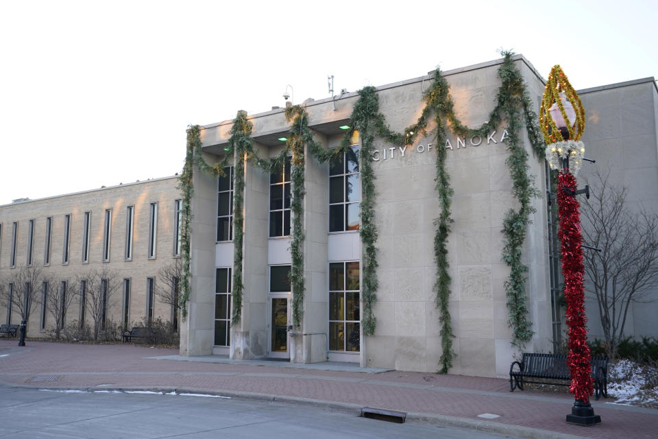 The Anoka City Hall is pictured Tuesday, Dec. 12, 2023, in Anoka, Minn. Hundreds of U.S. communities have enacted “crime-free” laws that encourage and allow landlords to evict tenants after repeated calls to police or for emergency services. Proponents say the laws help reduce crime, but the U.S. Department of Justice last year found that the Minneapolis suburb used its ordinance to illegally discriminate against people with mental illnesses (AP Photo/Abbie Parr)