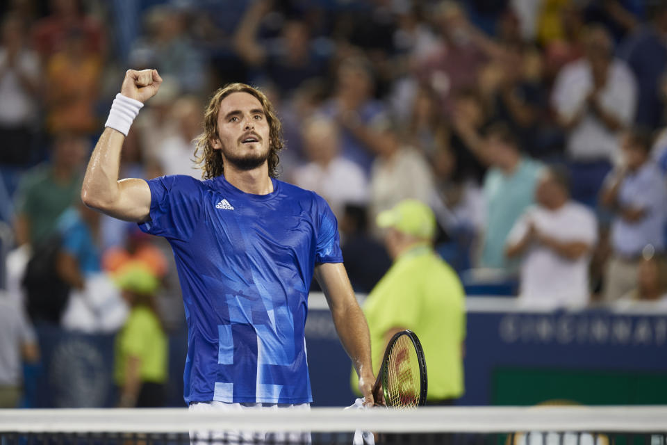 CINCINNATI, OH - AUGUST 20:  Stefanos Tsitsipas of Greece smiles at the crowd a does a fist pump after winning the quarterfinal match  against Felix Auger-Aliassime of Canada on day 5 of the Western & Southern Open at the Lindner Family Tennis Center in Mason, Ohio on August 20, 2021. (Photo by Shelley Lipton/Icon Sportswire via Getty Images)