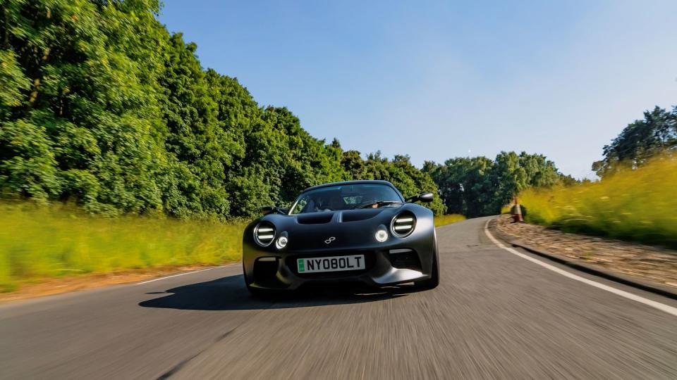 a black sports car on a road