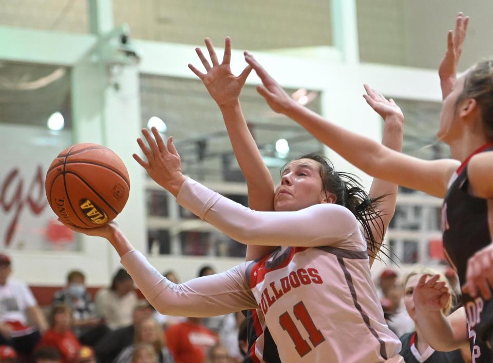 Freedom's Renae Mohrbacher shoots with pressure from several Westmont Hilltop players during Tuesday's first round Class 3A PIAA game at Freedom High School.