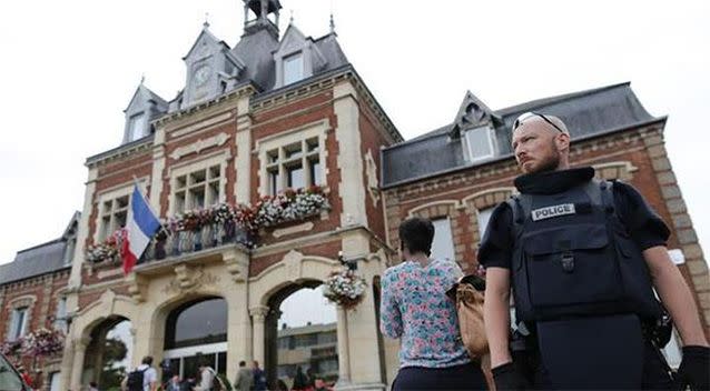 Police watch over Saint-Etienne-du-Rouvray's city hall. Photo: AFP