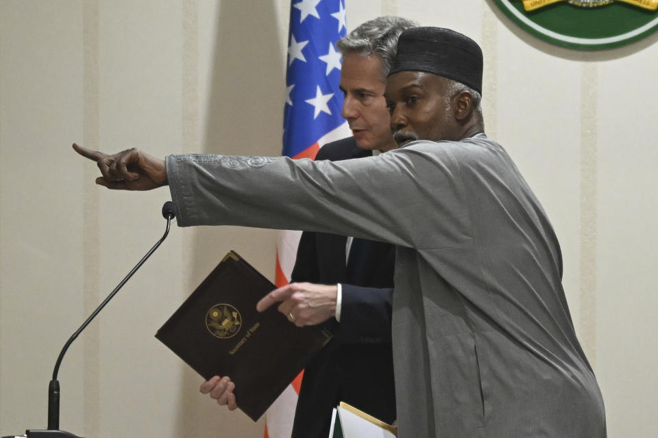 US Secretary of State Antony Blinken, left, listens as Nigeria's Minister of Foreign Affairs Yusuf Tuggar gestures, after a press conference at the Presidential Villa, in Abuja, Nigeria, Tuesday, Jan. 23, 2024. (Andrew Caballero-Reynolds/Pool Photo via AP)