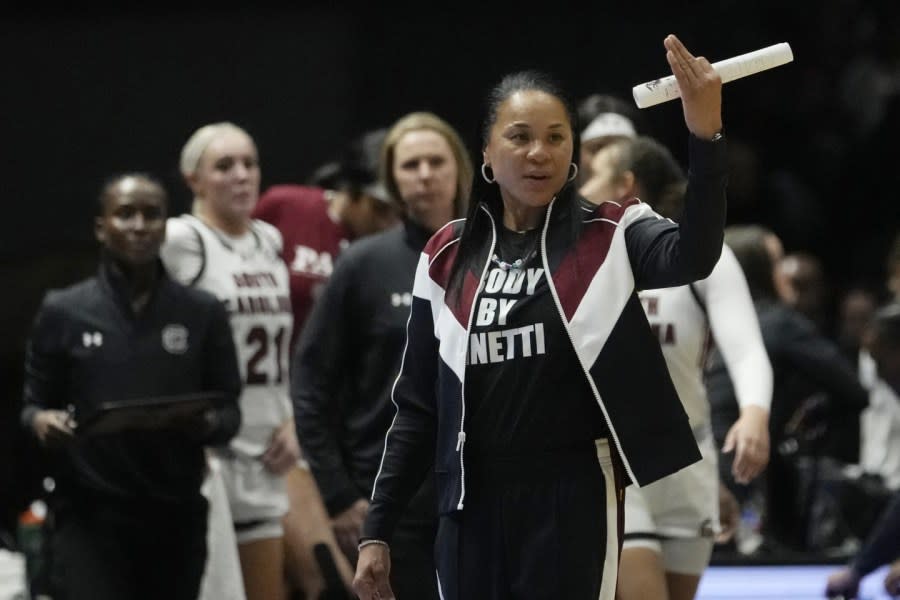 South Carolina head coach Dawn Staley signals from the bench during the second half of an NCAA college basketball game against Notre Dame Monday, Nov. 6, 2023, in Paris. (AP Photo/Thibault Camus)