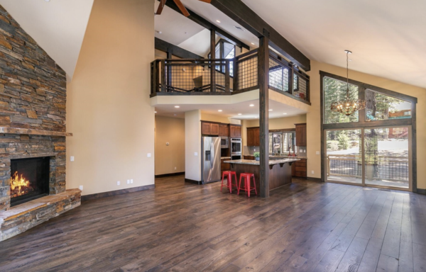 The existing cabin had a great room that was open to the second level, with views to the outdoors from either side of the home.