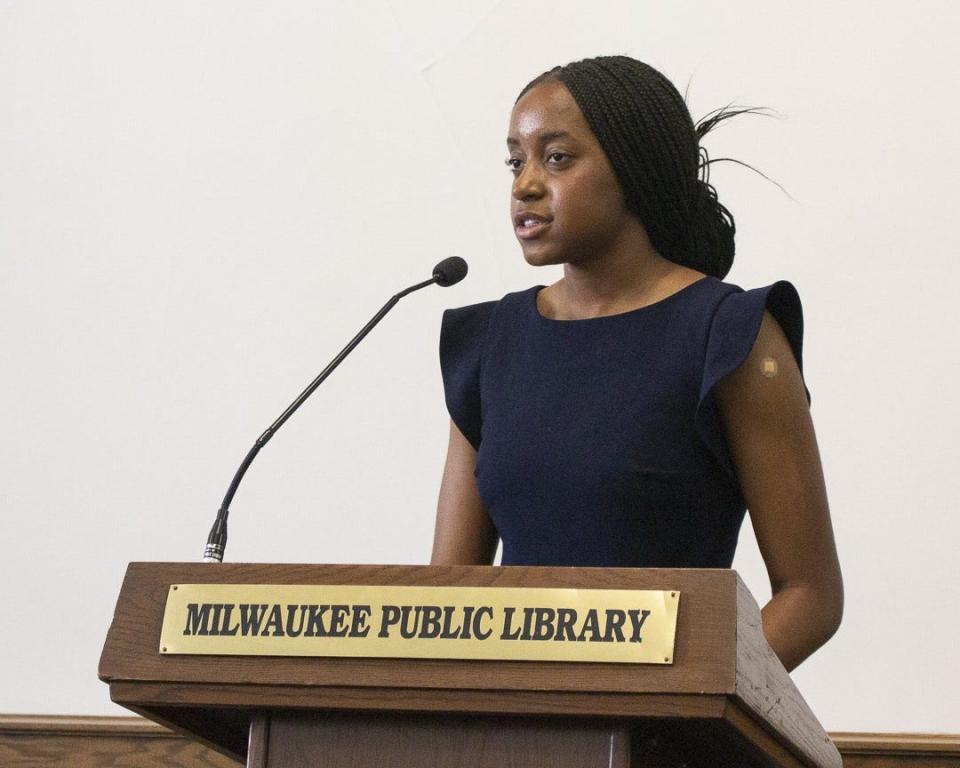 Emily Igwike speaks during her youth poet laureate inauguration at Milwaukee Public Library.