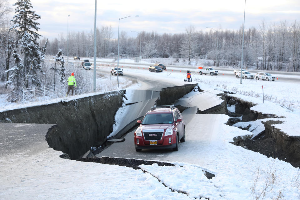 A vehicle sits stranded on a collapsed roadway near the airport after a major earthquake hit Anchorage, Alaska, on Nov. 30, 2018.