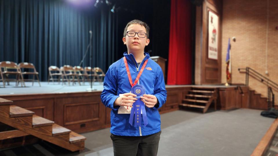 Jayden Zheng, a seventh-grader from Bonham Middle School, shows off his first-place ribbon Saturday at the 2023 Regional Spelling Bee at Tascosa High School in Amarillo.