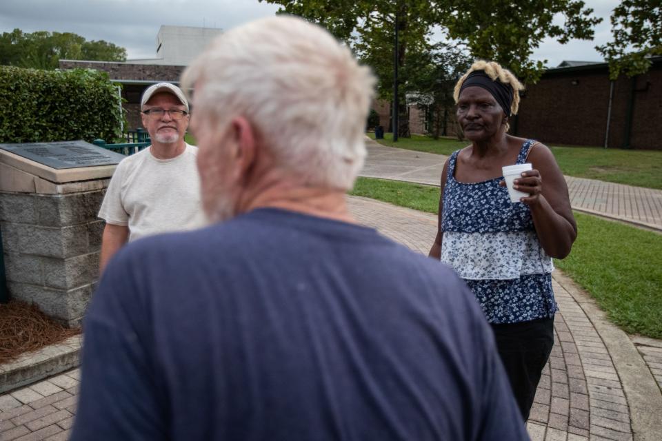 People from Steinhatchee and Perry, Florida chat outside Lincoln High School where they have come to shelter in place during Hurricane Idalia on Tuesday, Aug. 29, 2023.