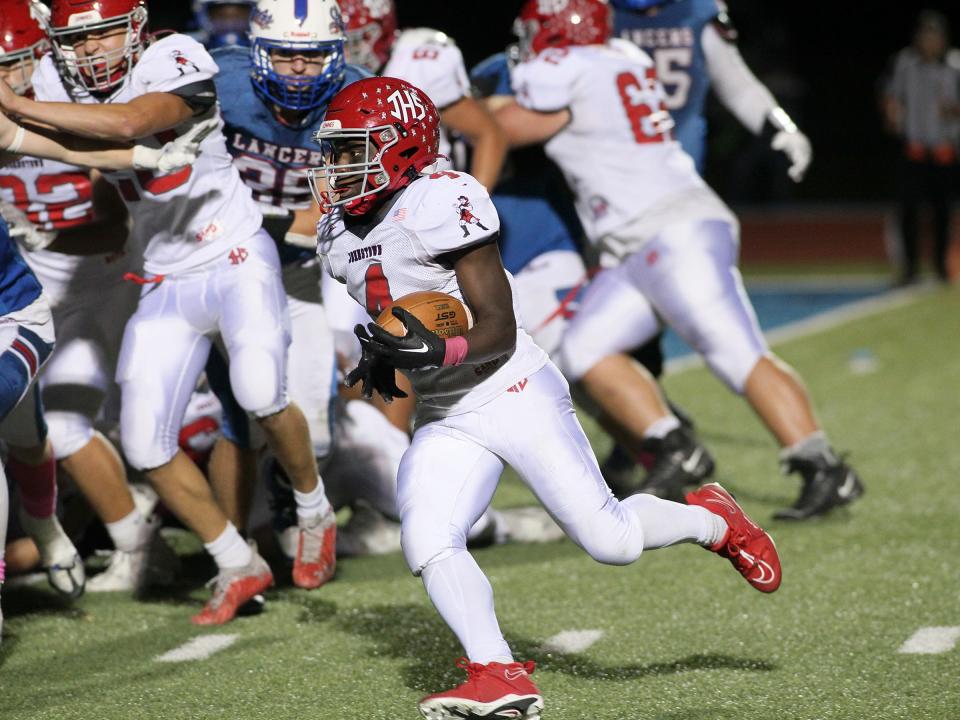 Johnstown's Nana Owusu heads into the end zone against Lakewood on Friday.