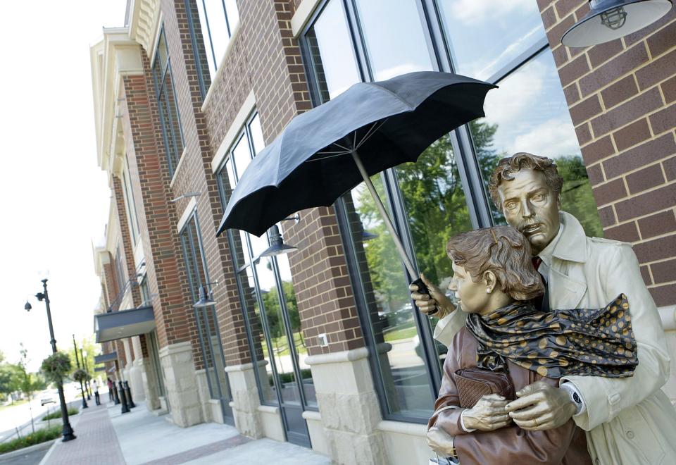 In his sculpture called "Elemental," located outside the Indiana Design Center at 200 S. Rangeline Road, artist Seward Johnson has created a universal image of a couple seeking shelter from the weather under an umbrella.