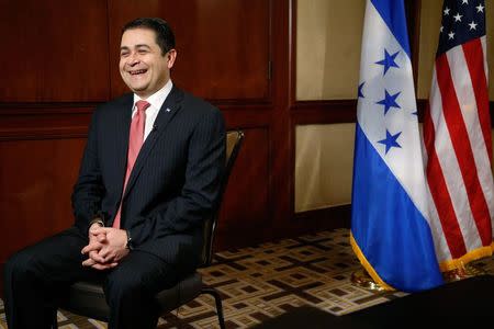 Honduran President Juan Orlando Hernandez sits for an interview at his hotel in Washington, November 12, 2014. REUTERS/Jonathan Ernst