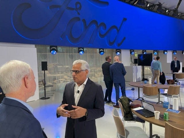 Kumar Galhotra, then president of Ford Blue, talks with John McElroy, host of "Autoline After Hours" webcast and podcast, prior to the Capital Markets Day at the Ford Experience Center on May 22, 2023.