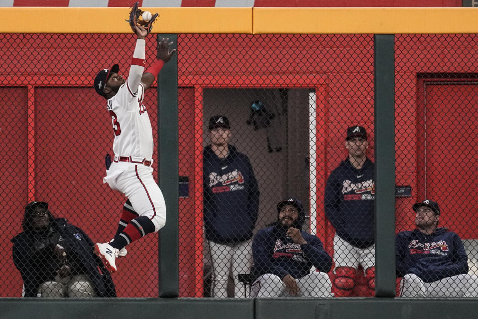 Atlanta Braves center fielder Michael Harris II (23) catches a fly ball off the bat of Philadelphia Phillies' Nick Castellanos (8) in the nineth inning of Game 2 of a baseball NL Division Series, Monday, Oct. 9, 2023, in Atlanta. The Atlanta Braves won 5-4. (AP Photo/John Bazemore)