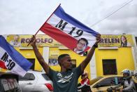 A supporter celebrates after former leftist rebel Gustavo Petro won a runoff presidential election in Cali, Colombia, Sunday, June 19, 2022. (AP Photo/Andres Quintero)