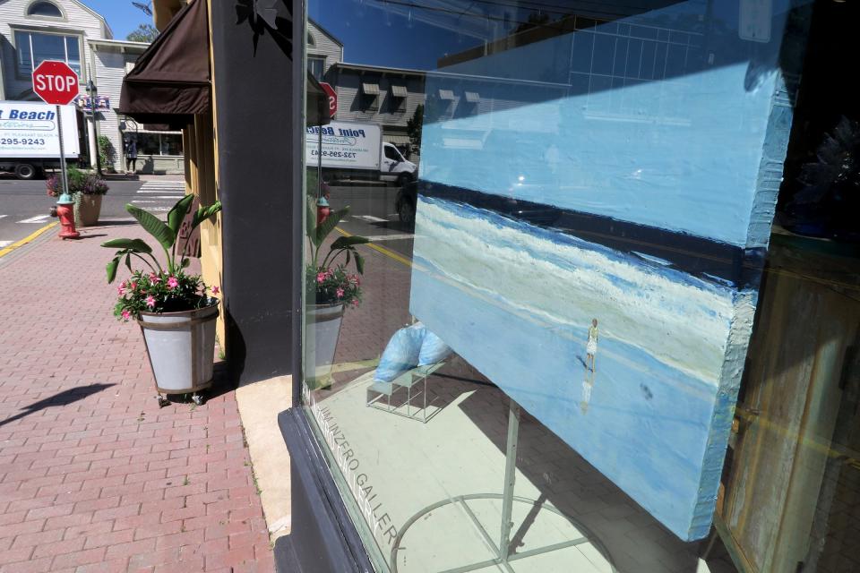 A painting is displayed in the front window at Jim Inzero's Contemporary Encaustic Painting art gallery on Bay Avenue in Point Pleasant Beach Friday, September 1, 2023. The gallery opened in 2018 by Inzero, an impressionist painter whose medium is beeswax.