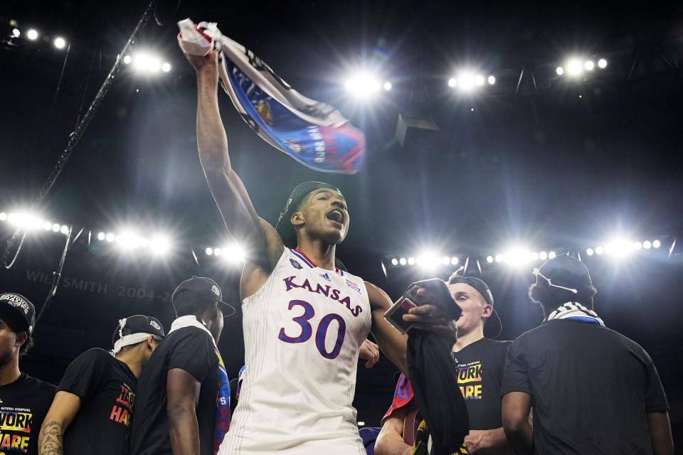 FILE - Kansas guard Ochai Agbaji celebrates after their win against North Carolina in a college basketball game at the finals of the Men's Final Four NCAA tournament, April 4, 2022, in New Orleans. (AP Photo/Brynn Anderson, File)