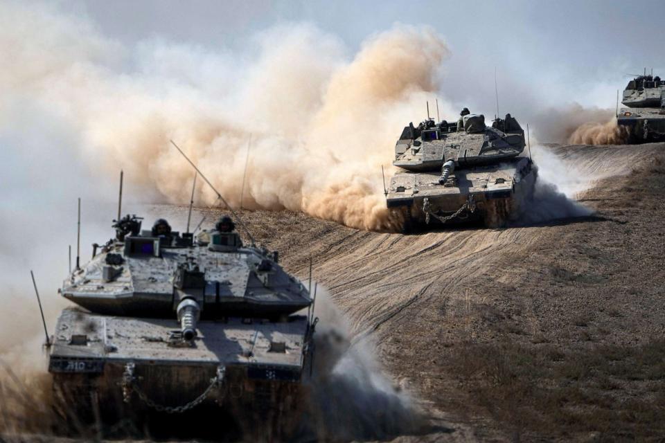 PHOTO: Israeli tanks head towards the Gaza Strip border in southern Israel, Oct.13, 2023. (Ariel Schalit/AP)