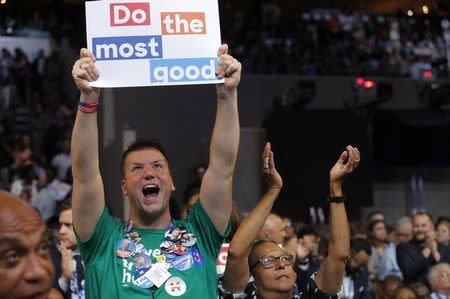 Delegates celebrate after U.S. presidential candidate Hillary Clinton won the Democratic presidential nomination at the Democratic National Convention in Philadelphia, Pennsylvania, U.S., July 26, 2016. REUTERS/Jim Young