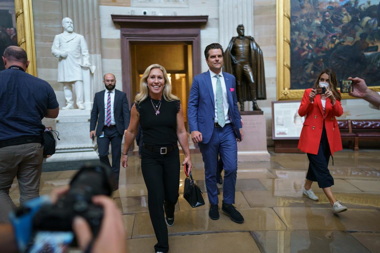 Marjorie Taylor Greene and Matt Gaetz walk through the Rotunda after going to the Senate chamber with other conservatives, to express their opposition to new mask guidance, at the Capitol in Washington, Thursday, 29 July 2021 (AP)