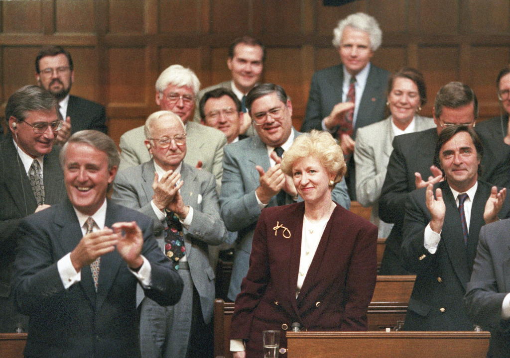 Kim Campbell, Leader of the Conservative Party and Prime Minister designate is given a standing ovation in the House of Commons by Prime Minister Brian Mulroney and other members of the government on June 16, 1993. The Canadian Press/Tom Hanson