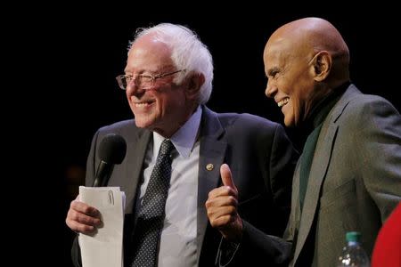 U.S. Democratic presidential candidate and U.S. Senator Bernie Sanders is joined by musician and activist Harry Belafonte at a campaign "Community Conversation" at the Apollo Theater in Harlem, New York April 9, 2016. REUTERS/Brian Snyder