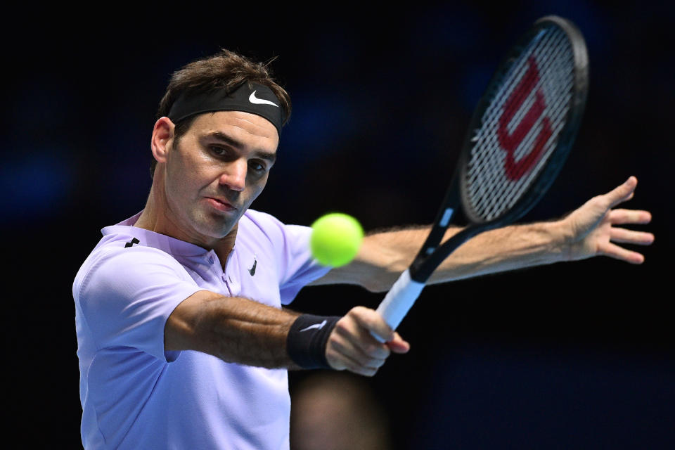 Switzerland’s Roger Federer returns to Croatia’s Marin Cilic during their men’s singles round-robin match on day five of the ATP World Tour Finals tennis tournament at the O2 Arena in London on November 16, 2017. (AFP Photo/Glyn KIRK )