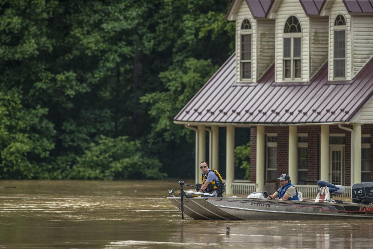 Homes are flooded by Lost Creek, Ky. on Thursday, July 28, 2022. Heavy rains have caused flash flooding and mudslides as storms pound parts of central Appalachia. Kentucky Gov. Andy Beshear says it's some of the worst flooding in state history.