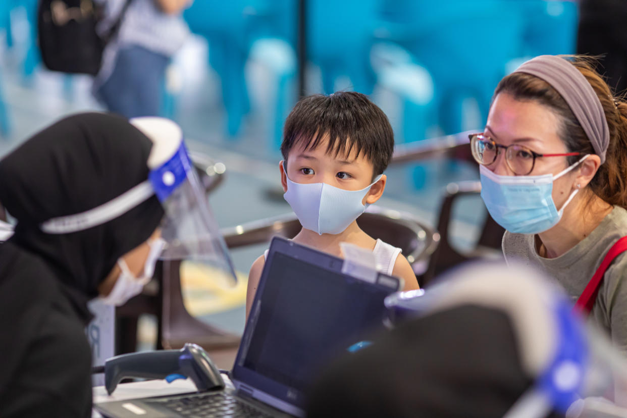 A child waiting his turn at the COVID-19 vaccination exercise for those aged five to 11 at  Our Tampines Hub Vaccination Centre on 12 January, 2022. (PHOTO: Ministry of Social and Family Development