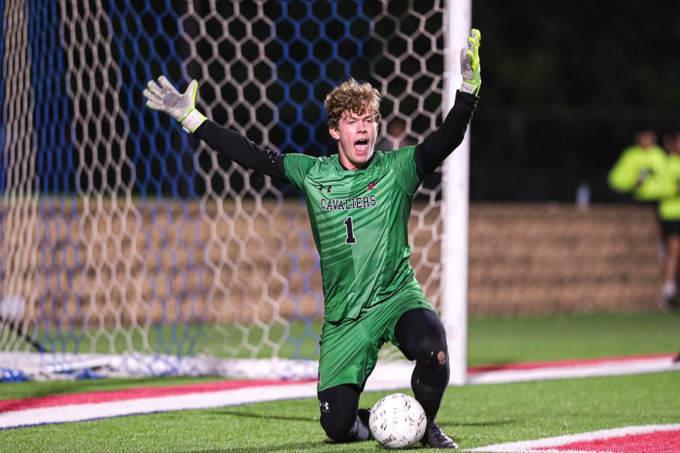 Lake Travis goalkeeper Adam Schantz celebrates after blocking a Plano penalty kick in the Class 6A boys soccer state championship in Georgetown on April 16. The Cavs' state title helped them finish tied for fourth in the Class 6A Lone Star Cup standings.