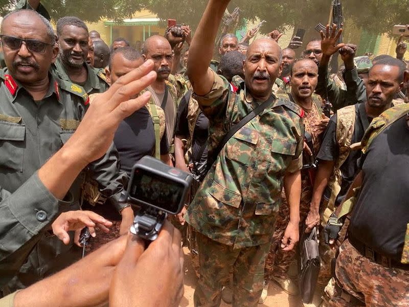 FILE PHOTO: Sudan's General Abdel Fattah al-Burhan talks to troops about truce extension