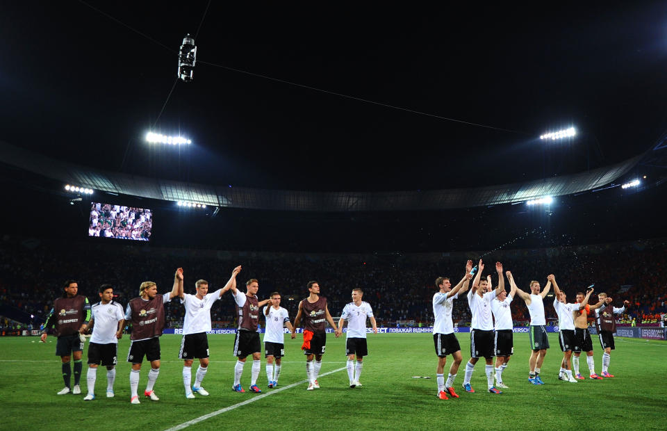 KHARKOV, UKRAINE - JUNE 13: The German team celebrate victory during the UEFA EURO 2012 group B match between Netherlands and Germany at Metalist Stadium on June 13, 2012 in Kharkov, Ukraine. (Photo by Lars Baron/Getty Images)