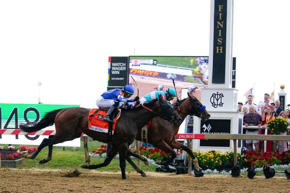 National Treasure, right, with jockey John Velazquez, edges out Blazing Sevens, with jockey Irad Ortiz Jr., to win the148th running of the Preakness Stakes horse race at Pimlico Race Course, Saturday, May 20, 2023, in Baltimore. (AP Photo/Julio Cortez) ORG XMIT: MDJC127