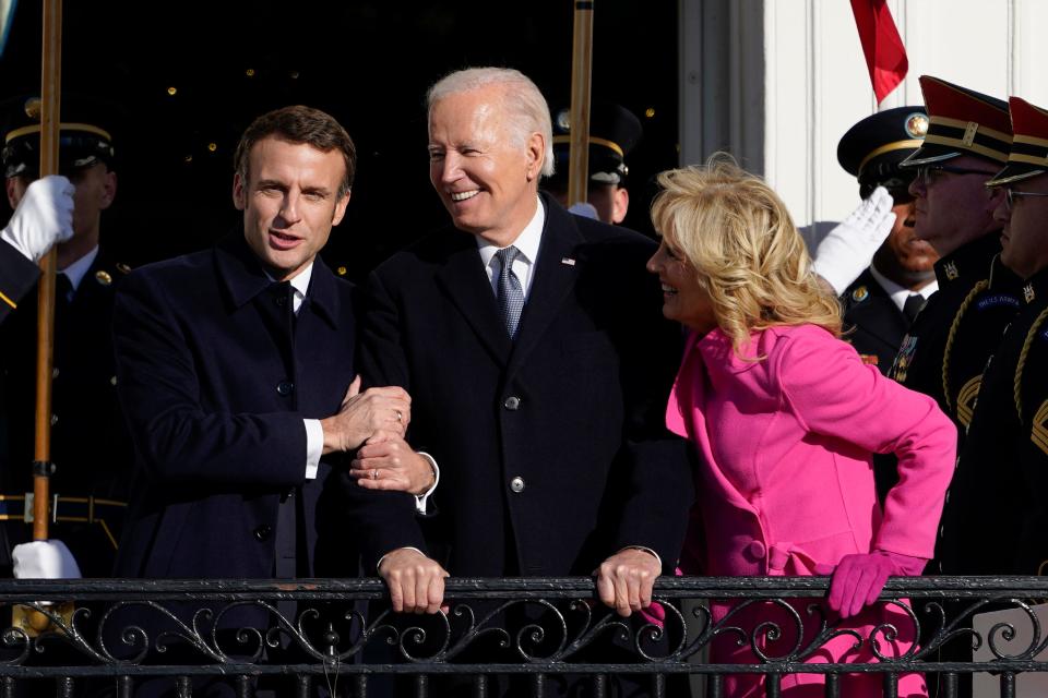 French President Emmanuel Macron greets President Joe Biden and first lady Jill Biden at an arrival ceremony on the South Lawn of the White House.