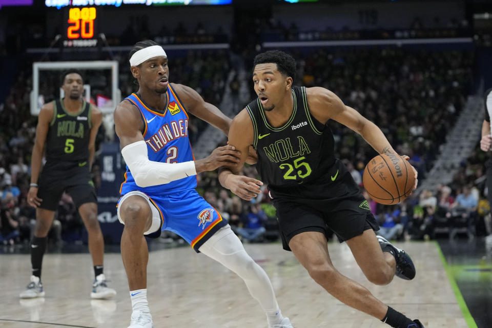 New Orleans Pelicans guard Trey Murphy III (25) drives to the lane against Oklahoma City Thunder guard Shai Gilgeous-Alexander (2) in the first half of Game 4 of an NBA basketball first-round playoff series in New Orleans, Monday, April 29, 2024. (AP Photo/Gerald Herbert)