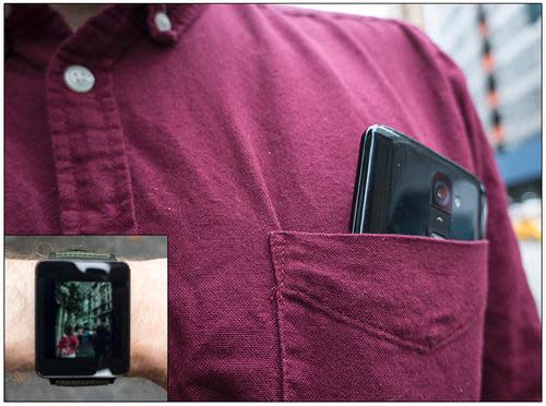 Smartphone camera protruding from shirt pocket