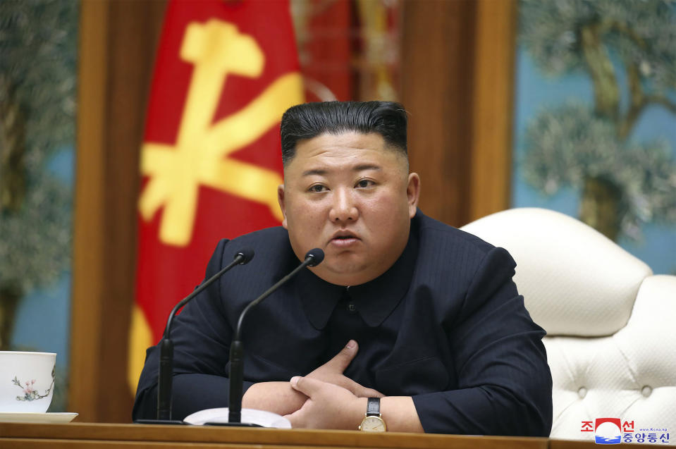 North Korean leader Kim Jong-un attends a meeting in Pyongyang on 11 April (AP)