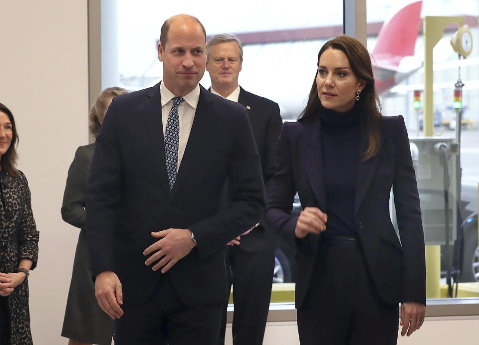Britain's Prince William and Kate, Princess of Wales, arrive at Boston Logan International Airport, Wednesday, Nov. 30, 2022, in Boston. They were met by Massachusetts Gov. Charlie Baker, rear, and first lady Lauren Baker. The Prince and Princess of Wales are making their first overseas trip since the death of Queen Elizabeth II in September. (John Tlumacki/The Boston Globe via AP, Pool)