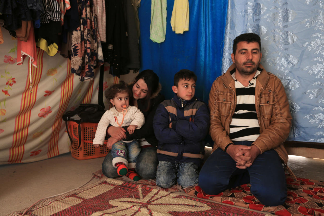 <span class="s1">Khudeeda Rashowka Naif and his family, from the Yazidi community, at a refugee camp near Duhok, Iraq, on Jan. 29. They were getting ready to head to the airport when their trip was called off because of President Trump’s decision to temporarily bar travelers from seven countries, including Iraq. (Photo: Ari Jalal/Reuters)</span>