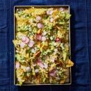 <p>Shredded chicken flavored with salsa verde and cilantro, then tossed with charred poblano pepper is the best way to get in some greens on game day.</p><p>Get the <a href="https://www.goodhousekeeping.com/food-recipes/a29738674/chicken-suizas-nachos-recipe/" rel="nofollow noopener" target="_blank" data-ylk="slk:Chicken Suizas Nachos recipe;elm:context_link;itc:0;sec:content-canvas" class="link "><strong>Chicken Suizas Nachos recipe</strong></a>.</p>