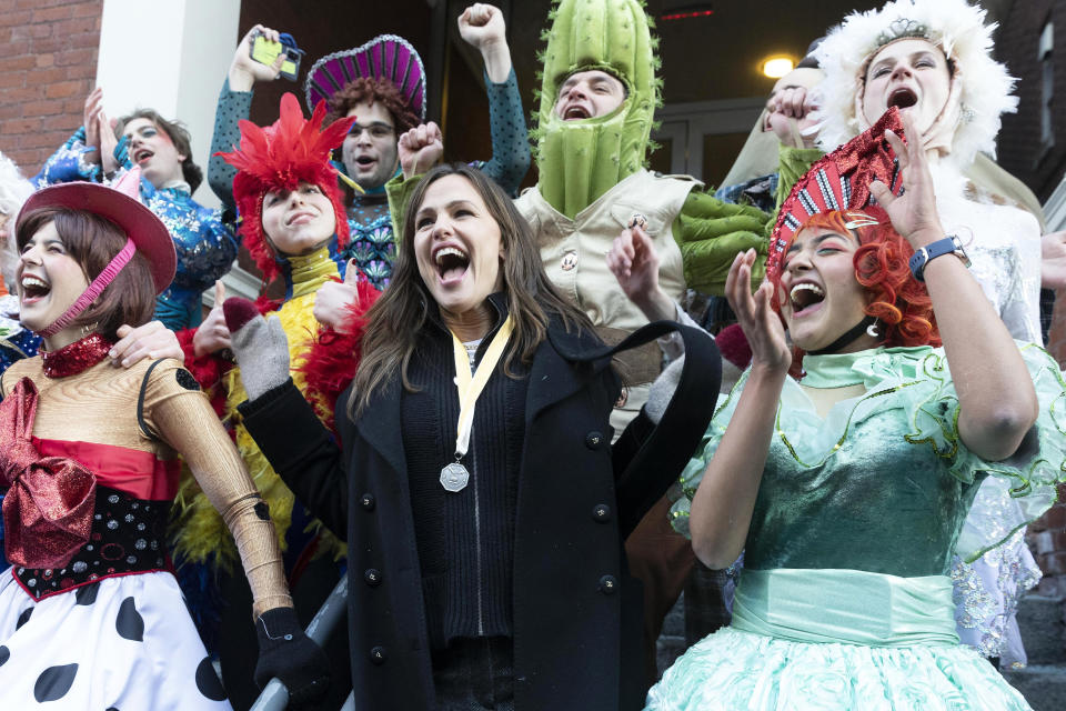 Jennifer Garner, center, poses with members of Harvard University's Hasty Pudding Theatricals following a parade which honored her as "Woman of the Year," Saturday, Feb. 5, 2022, in Cambridge, Mass. (AP Photo/Michael Dwyer)